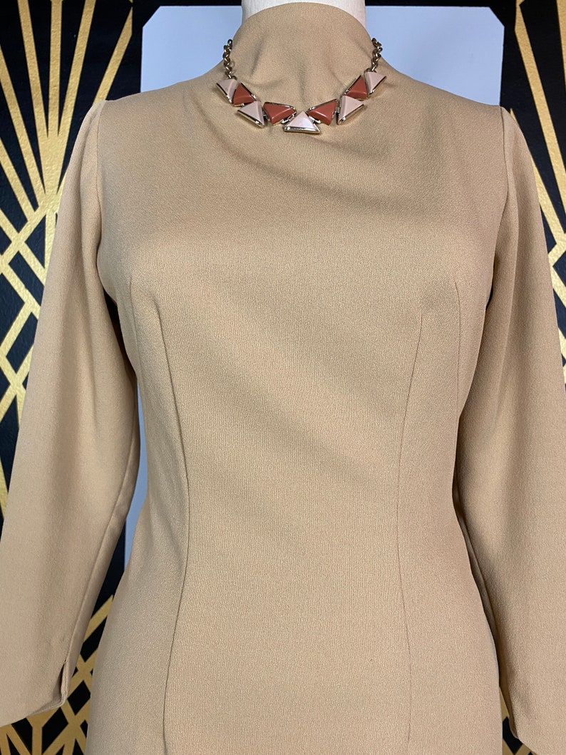 1960s wiggle dress, tan polyester, slim fit, vintage 60s dress, hourglass dress, long sleeve, size medium, simple, classic, high neck, 28 image 2