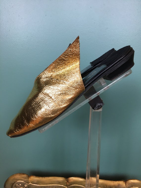 1990s gold flats, winged shoes, metallic gold shoe