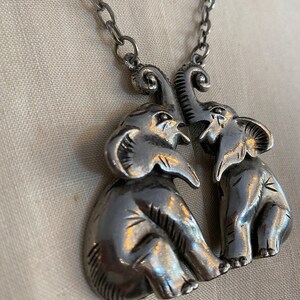 1970s necklace, novelty, double elephants, vintage jewelry, animals, silver tone, chunky pendant, good luck charm, late 60s, mod, funky image 3