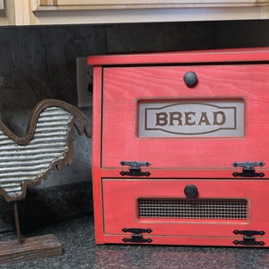 This D-LIGHTFUL DESIGNS ORIGINAL, beautiful Bread box / Vegetable bin is made from Pine or Spruce wood.  Each one is handmade by my husband and each will be a bit different due to wood grain and natural knots and flaws.
RUSTIC RED