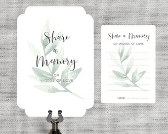 May include: A set of two cards with a watercolour green leaf design. The larger card says "Share a Memory or Words of Love". The smaller card has lines for writing and says "Share a Memory or Words of Love" at the top and "Love." at the bottom.