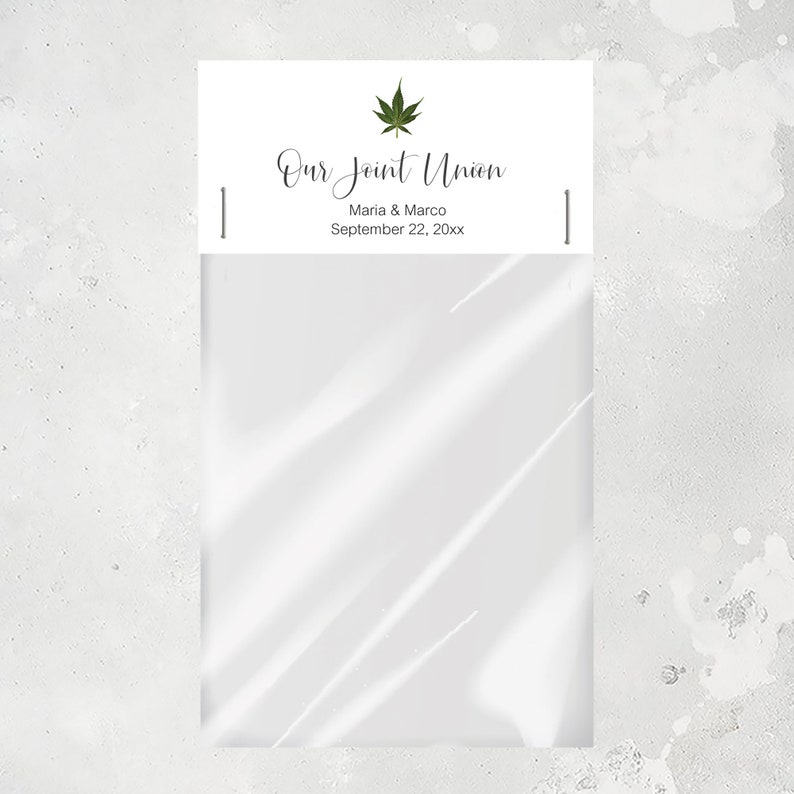 May include: White paper bag with a label that says "Our Joint Union" with a green marijuana leaf icon. The label also says "Maria & Marco" and "September 22, 20xx".