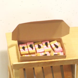 Miniature pastries in bakery box  Dollhouse food