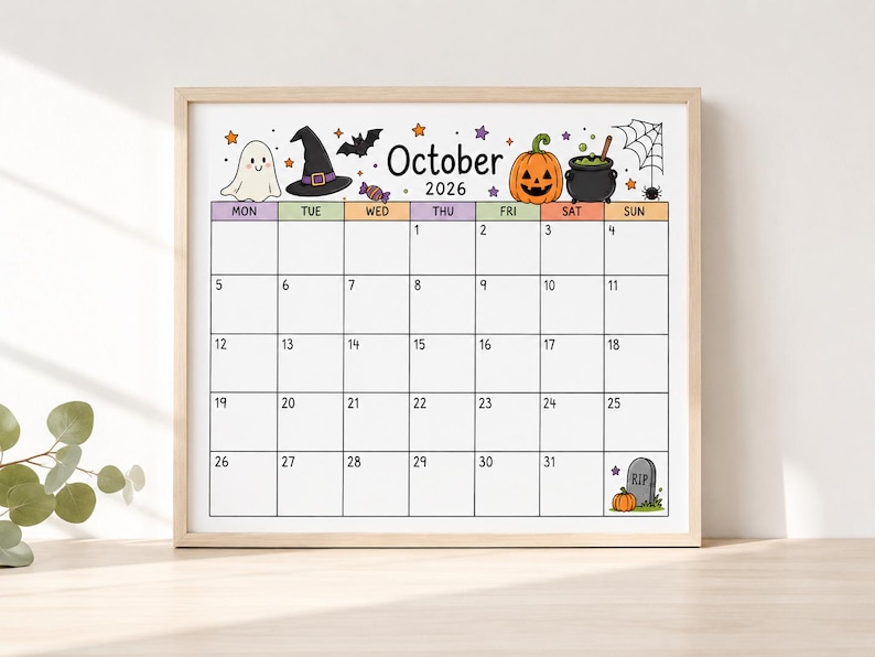Peut inclure: Une page de calendrier encadr&eacute;e pour octobre 2026 avec des illustrations d'Halloween comprenant un fant&ocirc;me blanc, un chapeau de sorci&egrave;re noir, une chauve-souris, une citrouille orange, un chaudron noir, une toile d'araign&eacute;e et une pierre tombale grise avec le texte RIP.