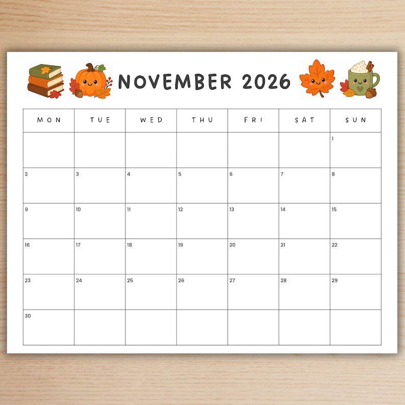 May include: A November 2026 calendar page featuring a white background with a black grid. The header displays the text NOVEMBER 2026, flanked by illustrations of a stack of books, a smiling orange pumpkin, a smiling maple leaf, and a green mug.