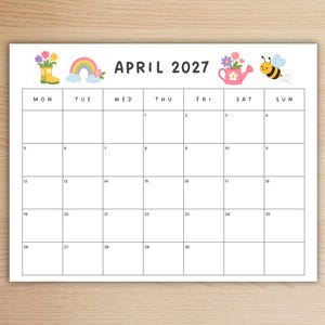 May include: A printable calendar page for April 2027 with a white background and black grid. The header features illustrations of a yellow rain boot with flowers, a rainbow, a pink watering can with flowers, and a bumblebee.