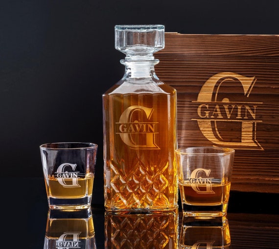 The engraved wooden box elevates this whiskey decanter set from 'nice gift' to 'presentable keepsake' — 222 favorites back it up.