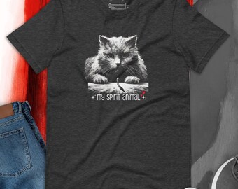 May include: A dark gray t-shirt with a black and white illustration of a large cat with a small person walking in front of it. The text "My spirit animal" is printed below the image.