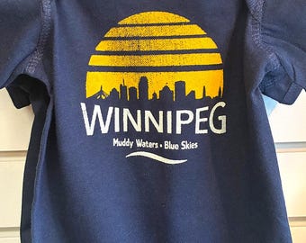 Winnipeg Baby One Piece, Muddy Waters Blue Skies, Black & Yellow Screenprint, Gray Baby Clothing