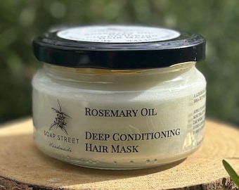 May include: A clear glass jar with a black lid containing a white hair mask. The label reads "Rosemary Oil Deep Conditioning Hair Mask" and "Soap Street Handmade".