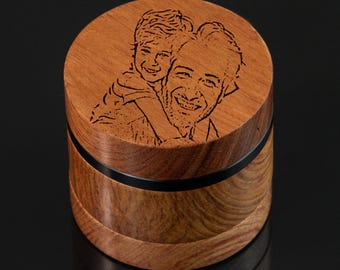 May include: A wooden box with a black band around the middle. The top of the box has a laser engraved image of a father and son.