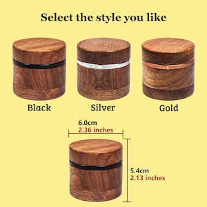 May include: Three cylindrical wooden grinders with black, silver, and gold metal bands. Text reads Select the style you like, Black, Silver, Gold. A single grinder is shown with dimensions of 6.0cm or 2.36 inches in diameter and 5.4cm or 2.13 inches in height.
