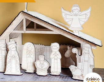 May include: A wooden nativity scene with laser-cut figures, including the Holy Family, wise men, an angel, and a sheep. The scene includes a stable with a star on top. The text "Laser tested" and "SVG laser ready files | Digital download" are visible.