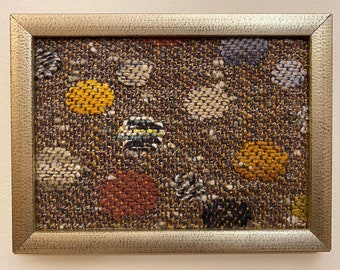 Small Stones and Gravel, handwoven textile, in golden wood frame