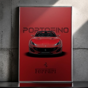 May include: Framed print featuring a red Ferrari Portofino sports car. The car is centered against a red background, with the name "Portofino" and the Ferrari logo displayed. The print is in a silver frame.