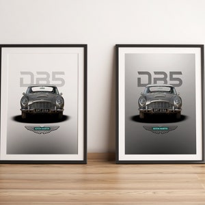 May include: Two framed prints of a silver Aston Martin DB5 car with the text "DB5" and the Aston Martin logo. The prints are on a light gray background.