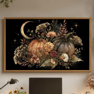 May include: A rectangular wall art print featuring a dark background with a crescent moon, stars, and a central arrangement of two pumpkins surrounded by dried flowers, foliage, and botanical elements in warm autumn tones of orange and brown.