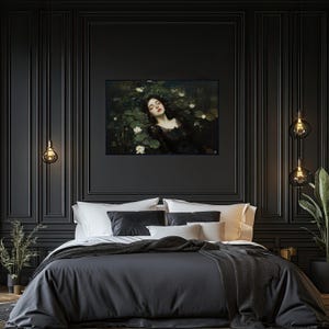 May include: A framed artwork showing a woman in a black dress in water with lily pads and white flowers. The artwork is on a black wall above a bed with dark grey bedding and white pillows. Decorative hanging lights are on either side of the artwork.