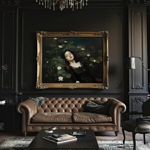 May include: A sophisticated living room with a large framed painting depicting a woman in a pond, above a brown leather Chesterfield sofa. The room has dark walls, a black coffee table, and a chandelier.