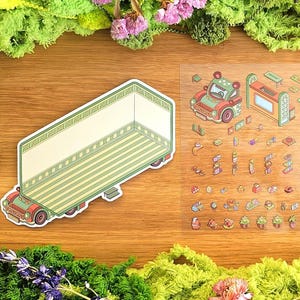 Könnte beinhalten: Isometrische Stickerbogen mit einem großen LKW und Bauelementen. Der LKW ist hellgrün und beige mit roten Akzenten. Der Bogen enthält ein Auto, Möbel und andere dekorative Elemente. Die Aufkleber befinden sich auf einem Holzgrund.