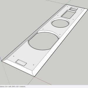 Può includere: Un cabinet per altoparlanti bianco con due tagli rotondi per altoparlanti e tre tagli rettangolari. Il cabinet è in legno e ha una finitura liscia.