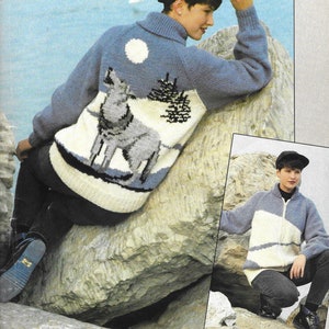 May include: Two knitted sweaters with a wolf design. The sweater on the left is blue with a white wolf and a white moon. The sweater on the right is white with a blue stripe and a zipper.