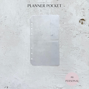 May include: A clear, plastic planner pocket with two compartments and pre-punched holes for binding. The text "PLANNER POCKET" is at the top, and "A6 PERSONAL" is at the bottom. The pocket is designed for organizing planner inserts.