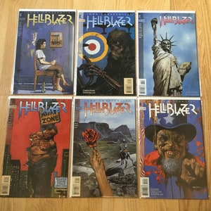 May include: A set of six Hellblazer comic books featuring John Constantine. The covers feature various illustrations, including a woman in a room, a skeletal figure, the Statue of Liberty, a man with a sign, a hand holding a rose, and a man with a beard and a star-spangled hat.
