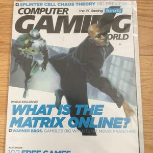 May include: A magazine cover for Computer Gaming World, featuring a black and white image of two figures in a futuristic setting. The cover text reads "What is the Matrix Online?" and "Warner Bros. Gambles Big with its Hit Movie Franchise". The magazine also features a promotion for 102 free games.