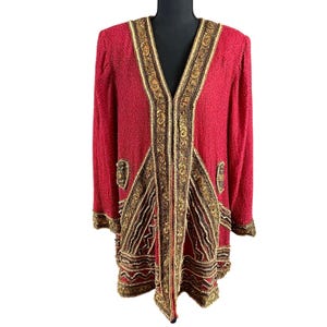 May include: A red beaded jacket with gold and brown embellishments. The jacket has a V-neck and long sleeves. The gold and brown embellishments are along the edges and in decorative patterns.