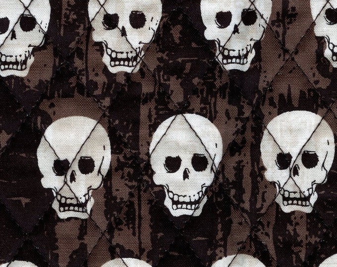 Skulls and polka dots, pre quilted fabric by Riley Blake