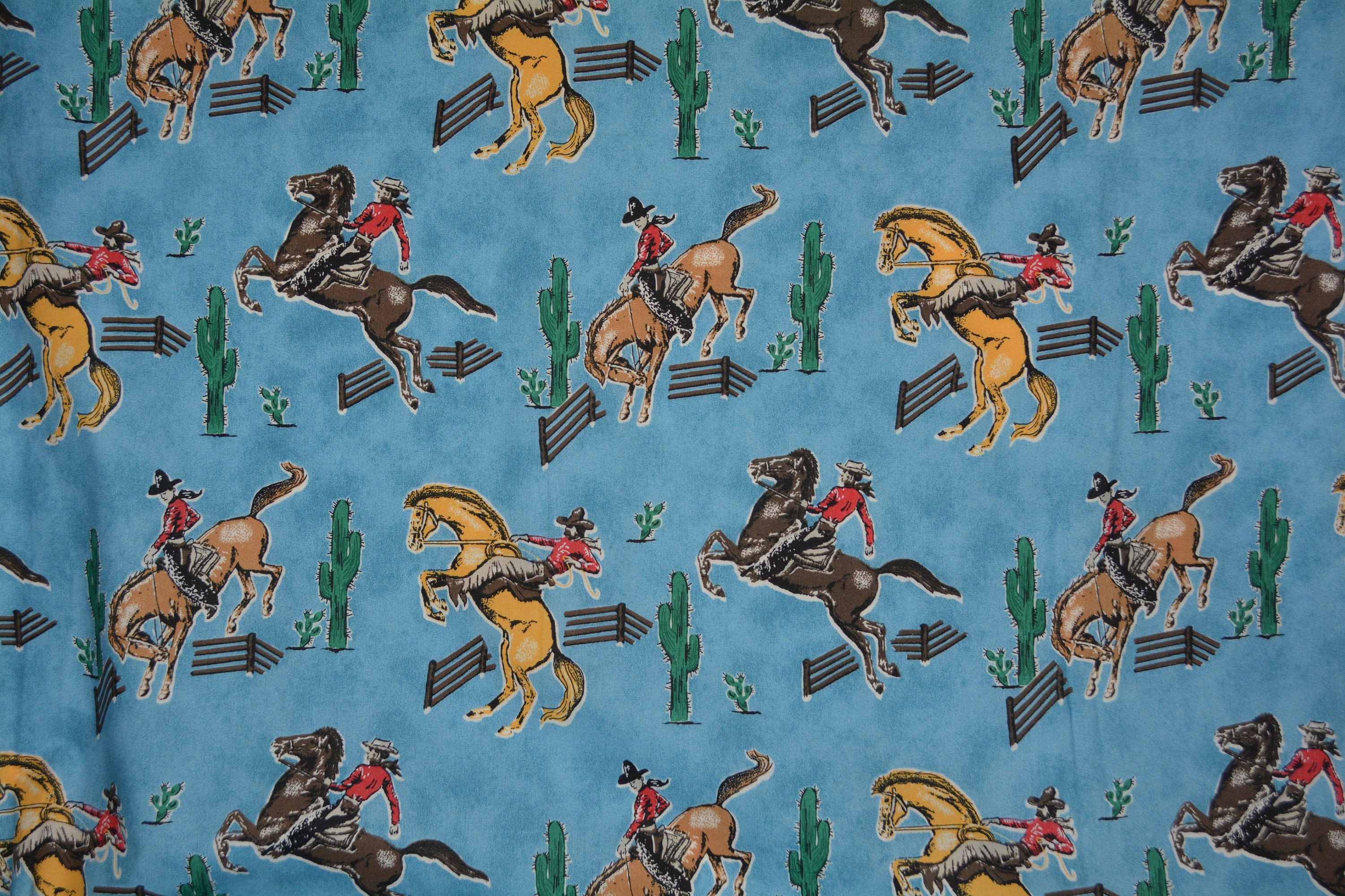 Cowboy cotton fabric Bronco horses bucking cowboys Fabric Traditions
