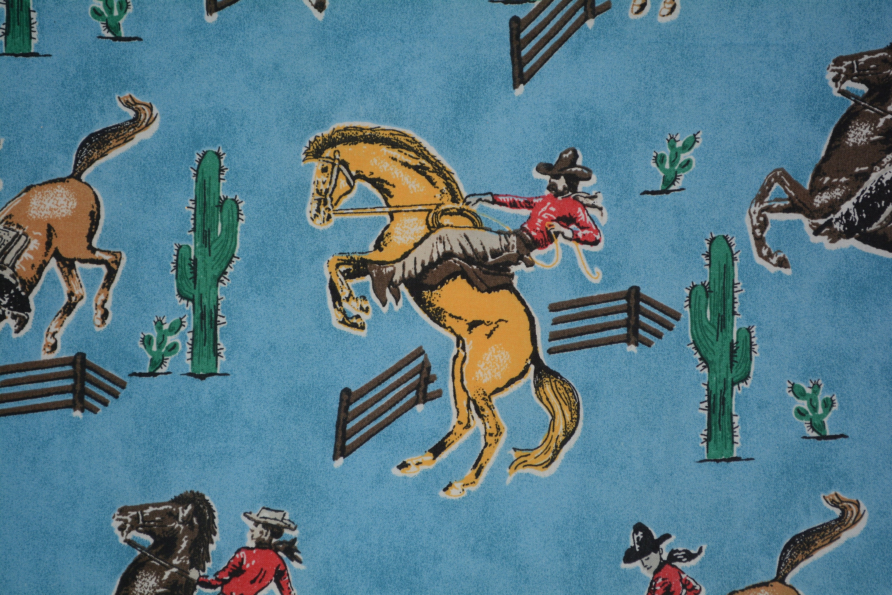 Cowboy cotton fabric Bronco horses bucking cowboys Fabric Traditions