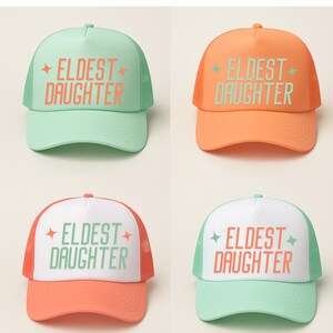 Printed eldest daughter trucker hat with mesh back, designed as a casual keepsake gift for daughters, perfect for birthdays or family matching outfits.