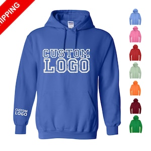 May include: A royal blue hooded sweatshirt featuring the white text CUSTOM LOGO on the chest and on the right sleeve. A column of seven smaller hoodies in blue, pink, red, light green, orange, maroon, and green is displayed on the right side.