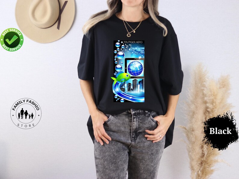 May include: Black t-shirt featuring a vibrant graphic with a fish, globe, and city skyline design. The design incorporates blue and green hues, with the text "FRUTIGER AERO" at the top. The shirt is a casual wear item.