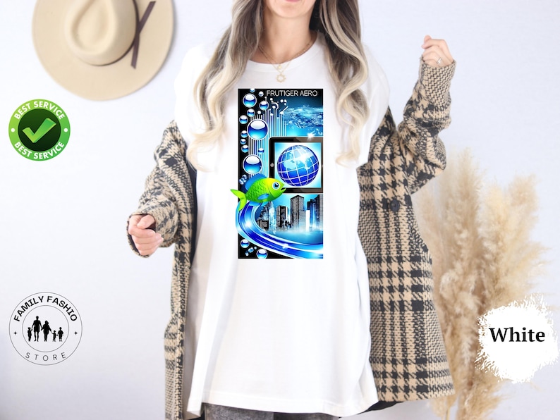 May include: White t-shirt featuring a colorful graphic design. The design includes a fish, a globe, and a cityscape, with the text "FRUTIGER AERO" at the top. The shirt is part of the Family Fashio Store collection.