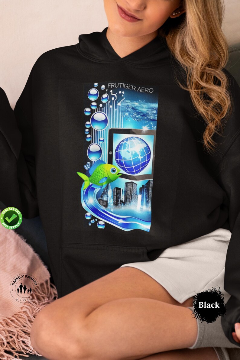 May include: Black hoodie featuring a colorful graphic with the text "FRUTIGER AERO." The design includes a blue and green fish, a tablet with a globe, and city skyline elements. The hoodie has a relaxed fit.