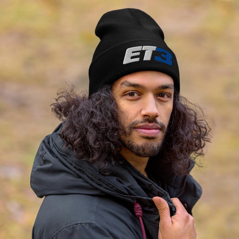 May include: A black beanie with a white and blue "ET3" logo embroidered on the front.
