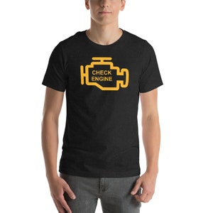 May include: A black t-shirt featuring a yellow check engine light icon with the text "CHECK ENGINE".