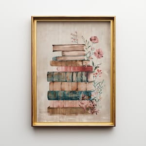 May include: A framed print showing a pile of old books with floral decorations. The books are in shades of brown, teal, and pink, set within a gold frame. The artwork is in a watercolour style.