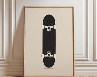 May include: Framed art print featuring a black skateboard with white wheels and trucks. The skateboard is centered against a beige background, framed in a light brown wooden frame. The artwork is displayed against a white wall and wooden floor.