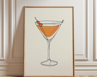 Può includere: Una stampa artistica incorniciata con un disegno a tratto minimalista di un cocktail in un bicchiere da Martini. La bevanda è arancione, guarnita con due ciliegie rosse su uno stuzzicadenti. L'opera è ambientata su uno sfondo color crema.
