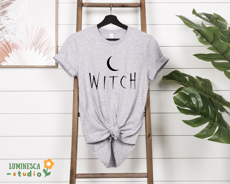 a t - shirt with the word witch on it
