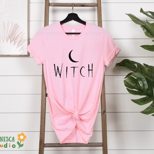 a pink shirt with the word witch on it