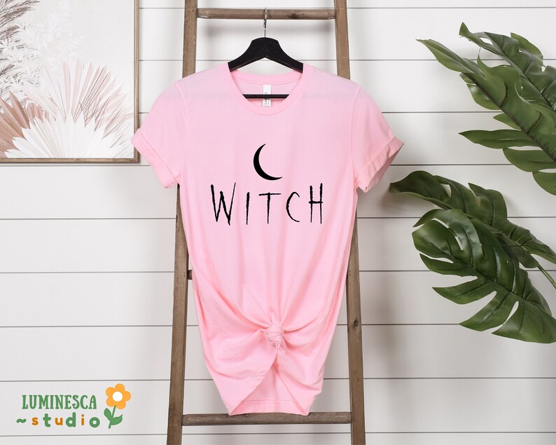 a pink shirt with the word witch on it