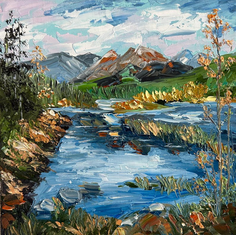 May include: Impasto oil painting of a mountain landscape with a river. The artwork features a blue river flowing through a valley, with mountains in the background. The sky is a mix of blue and white, with hints of pink.