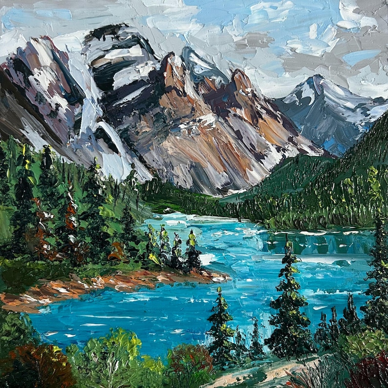 May include: An oil painting depicts a mountain landscape with a turquoise lake and evergreen trees. The mountains have snow-capped peaks and are painted in shades of brown, gray, and white. The sky is a mix of blue and gray.