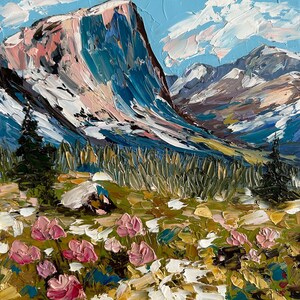 May include: An oil painting depicts a mountain landscape with a large, snow-capped peak in shades of blue, pink, and white. The foreground features pink flowers and green foliage. The sky is a light blue with white clouds.