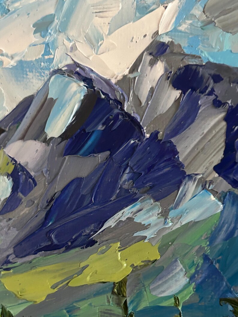 May include: An abstract oil painting of a mountain range. The artwork features textured brushstrokes in shades of blue, gray, white, and green. The painting evokes a sense of depth and the rugged beauty of nature.
